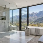 stainless steel & glass floor to ceiling shower glass